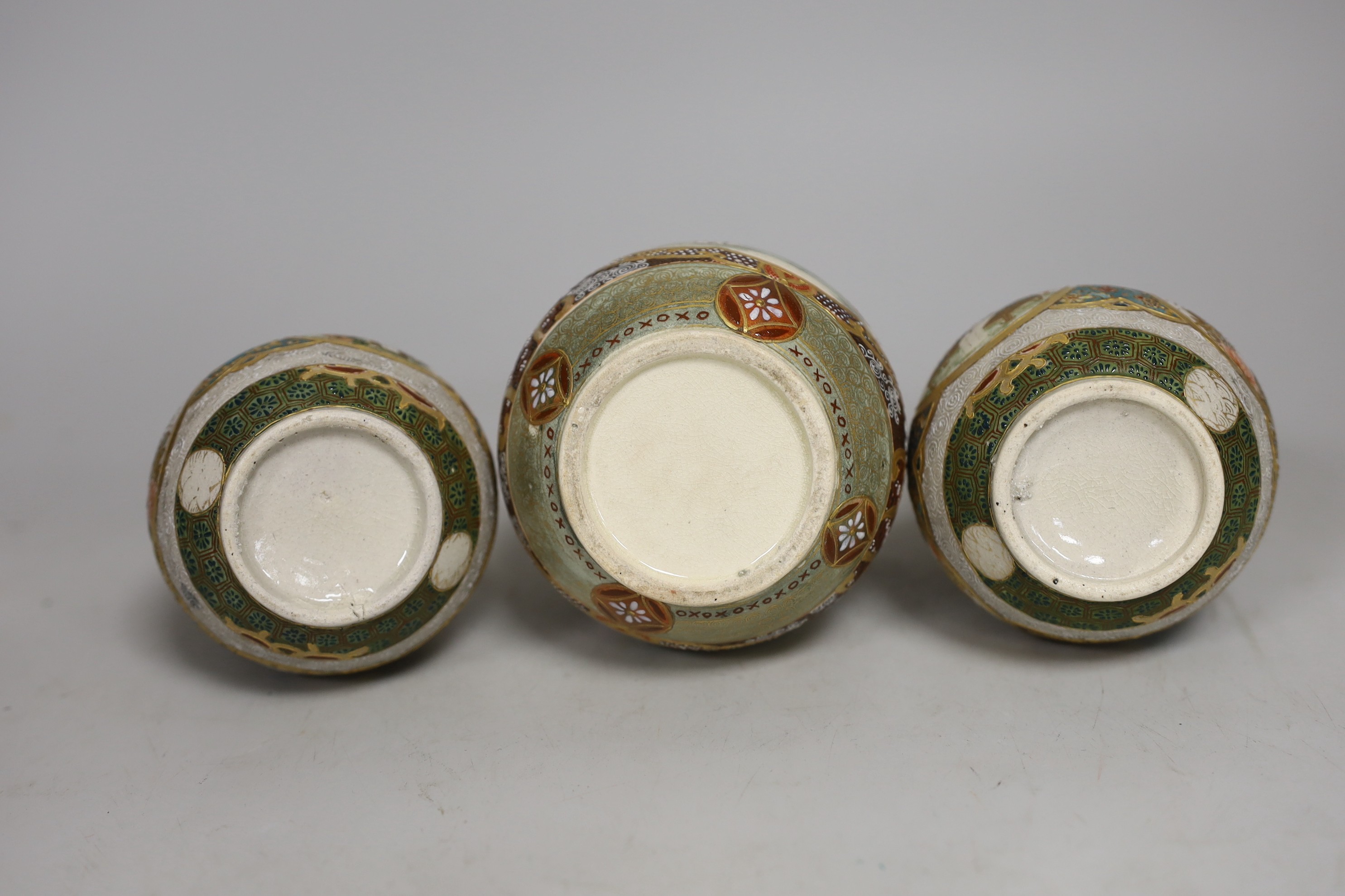 A pair of Japanese Satsuma pottery double gourd shaped vases another similar single vase,. Tallest 15cm